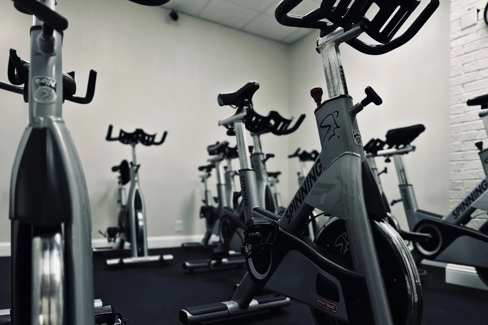 Indoor cycling studio at Mass Appeal Fitness in Winchester, TN featuring spin bikes used for RPM and cardio classes in a 24-hour local gym.